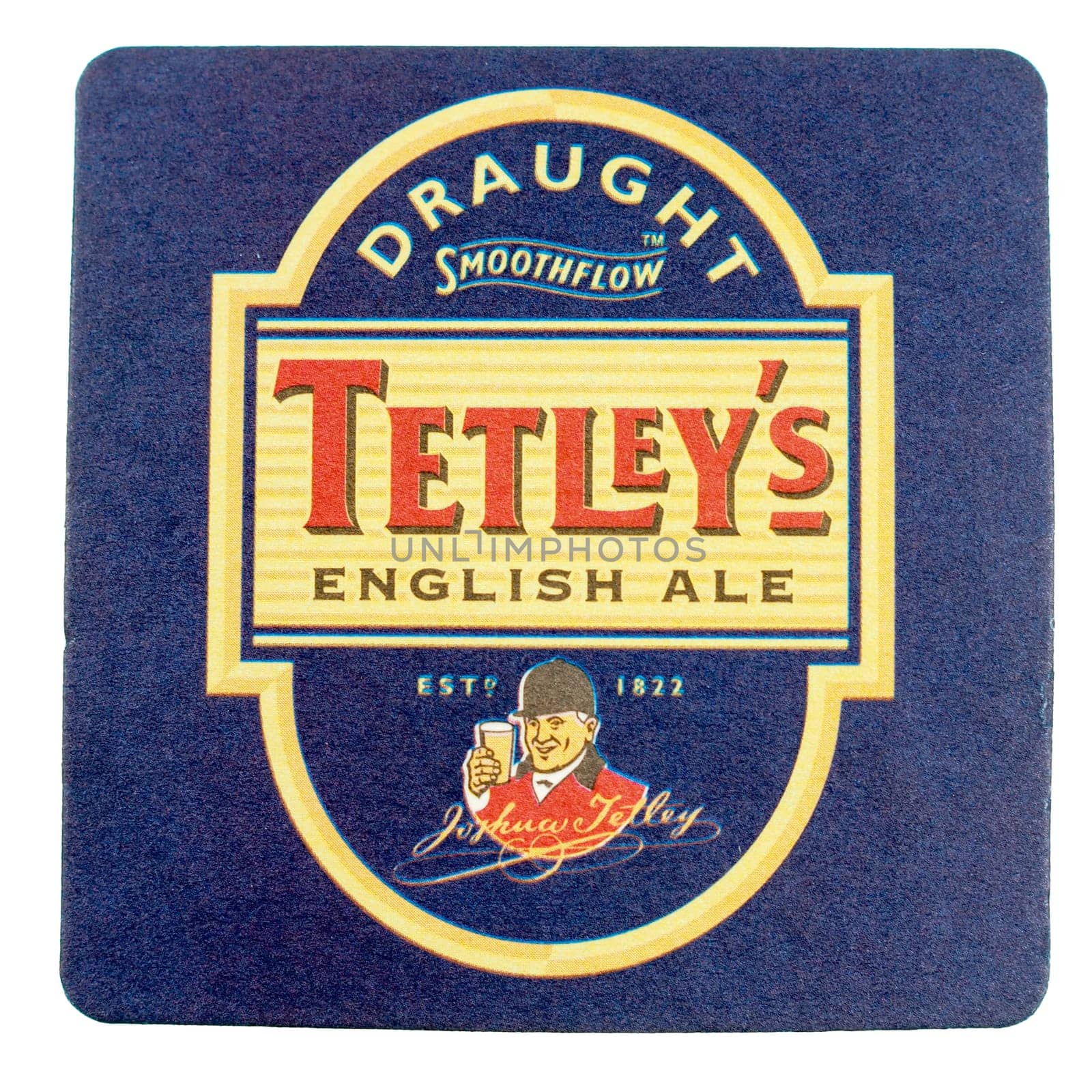 LONDON, UK - MARCH 15, 2015: Beermat of British beer Tetley isolated over white background