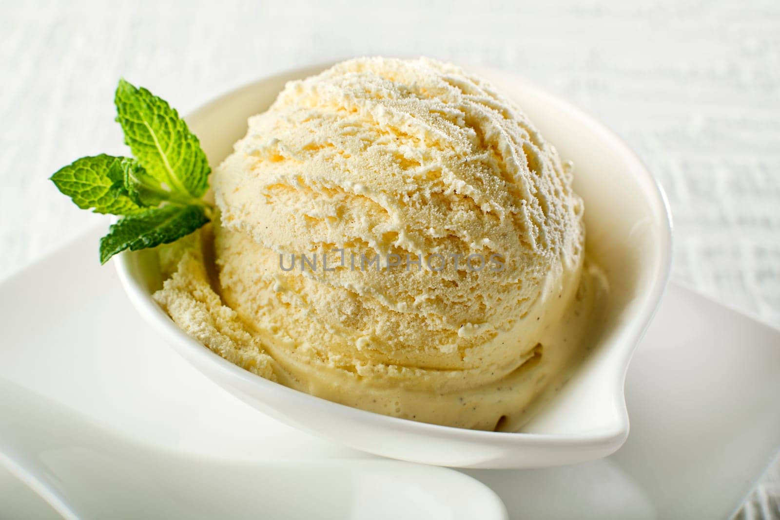 Ice cream in a bowl on white background