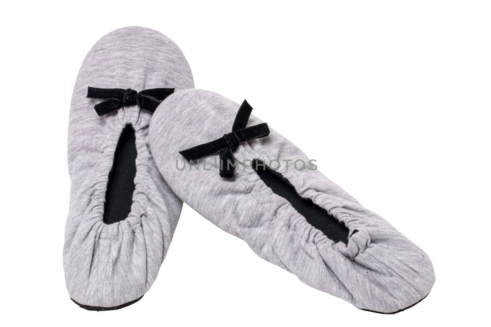 Slippers isolated. Close-up of a pair of female gray warm and soft cosy slippers with non-slip sole isolated on white background. Shoes of a woman. Macro.