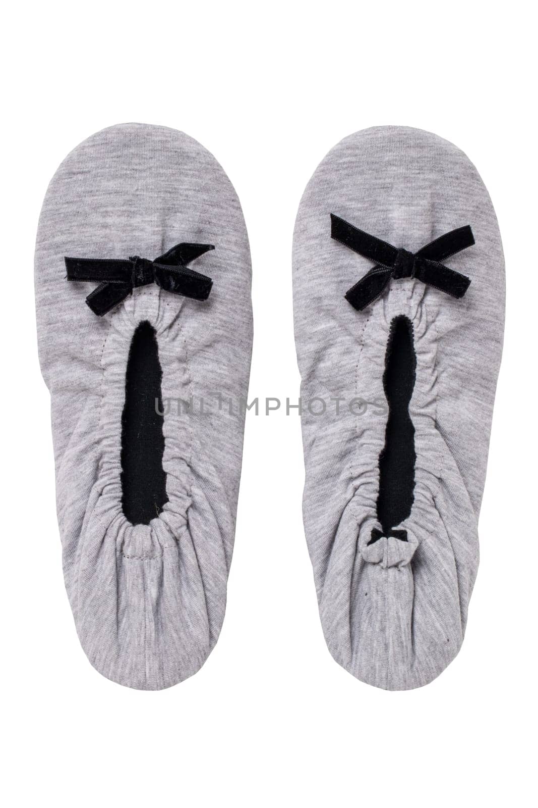 Slippers isolated. Close-up of a pair of female gray warm and soft cosy slippers with non-slip sole isolated on white background. Shoes of a woman. Macro.