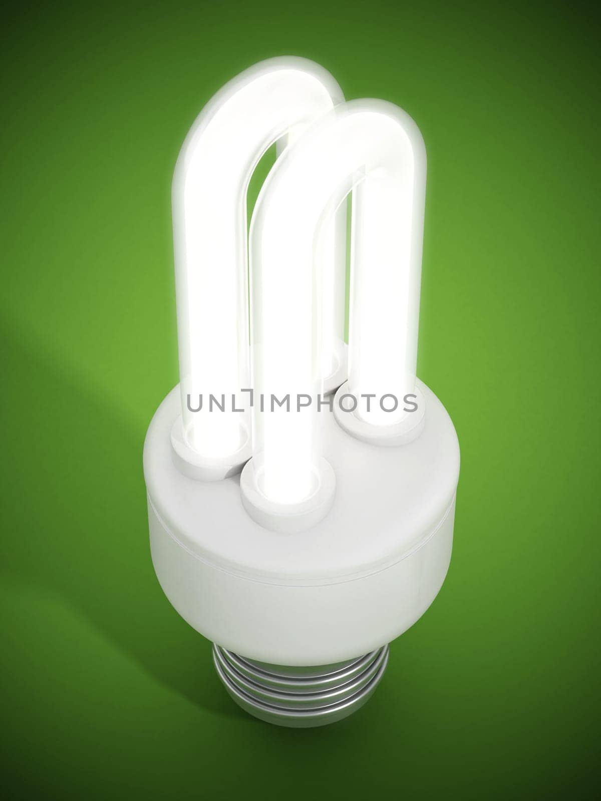 Fluorescent energy saving lightbulb on green surface.