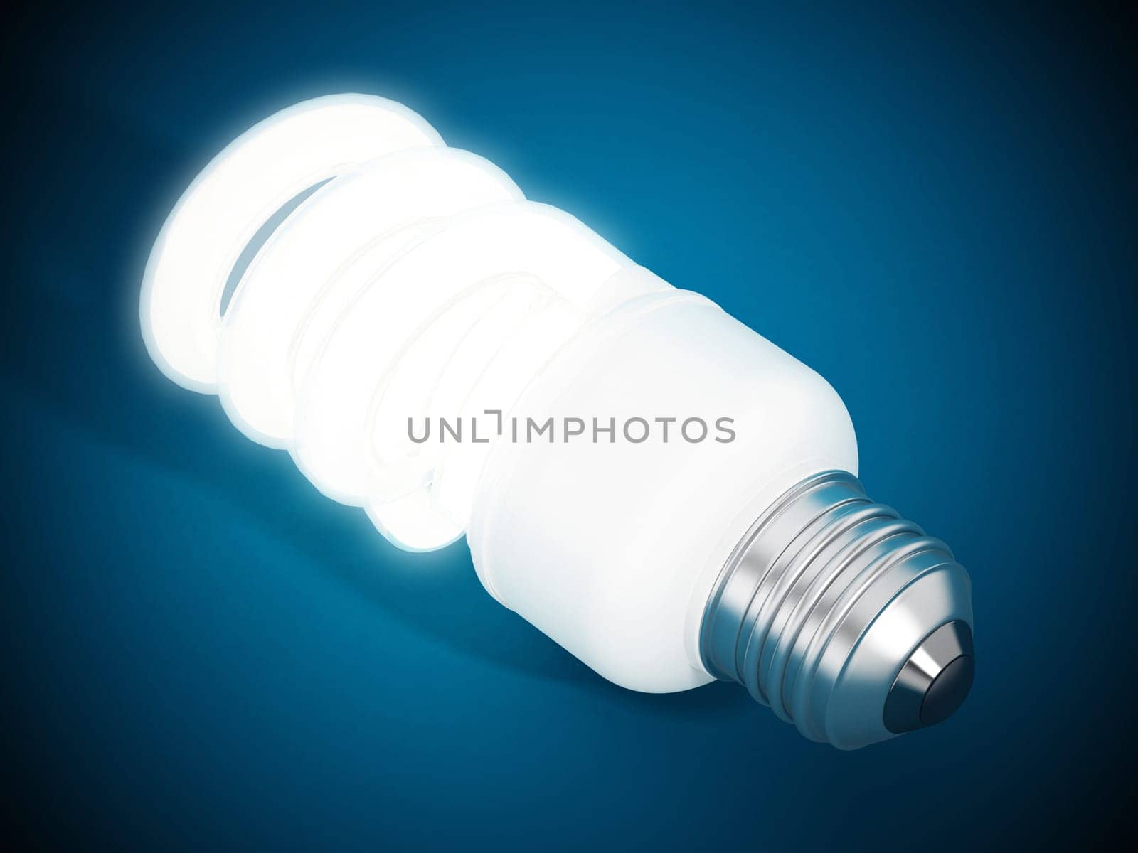 Fluorescent energy saving lightbulb on blue surface.