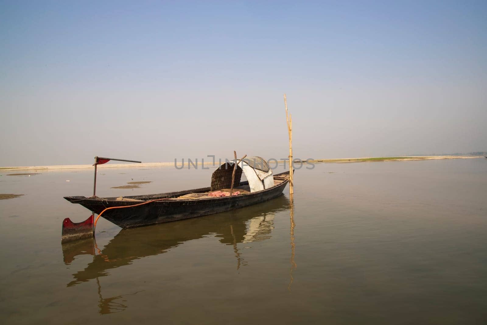 A Wooden Fishing Boat in Padma River by Bangladesh. Beautiful Landscape View