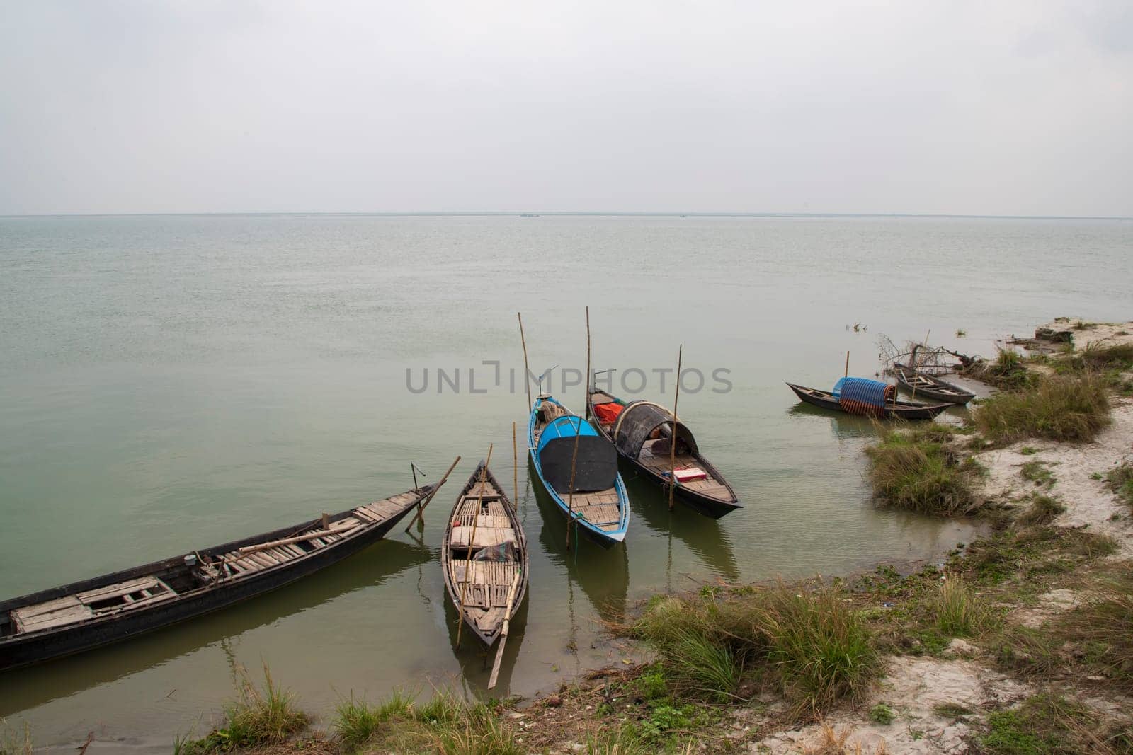 Beautiful Landscape View of Some wooden fishing boats on the bank of the Padma river in Bangladesh
