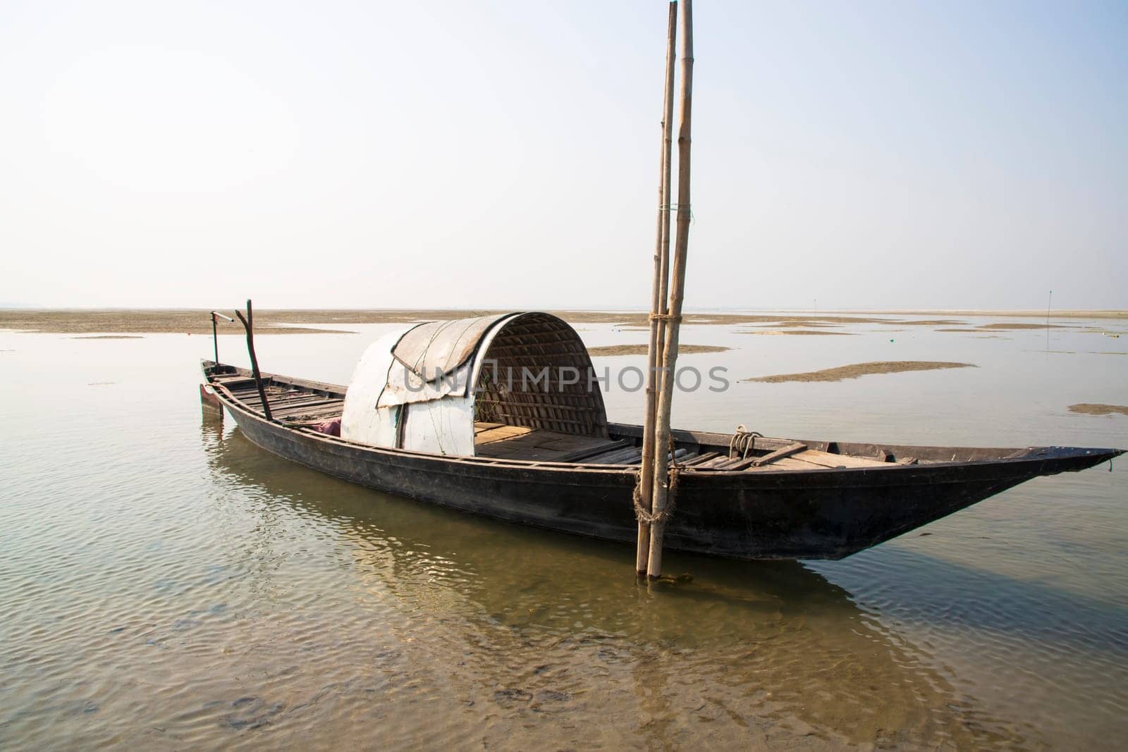 A Wooden Fishing Boat in Padma River by Bangladesh. Beautiful Landscape View