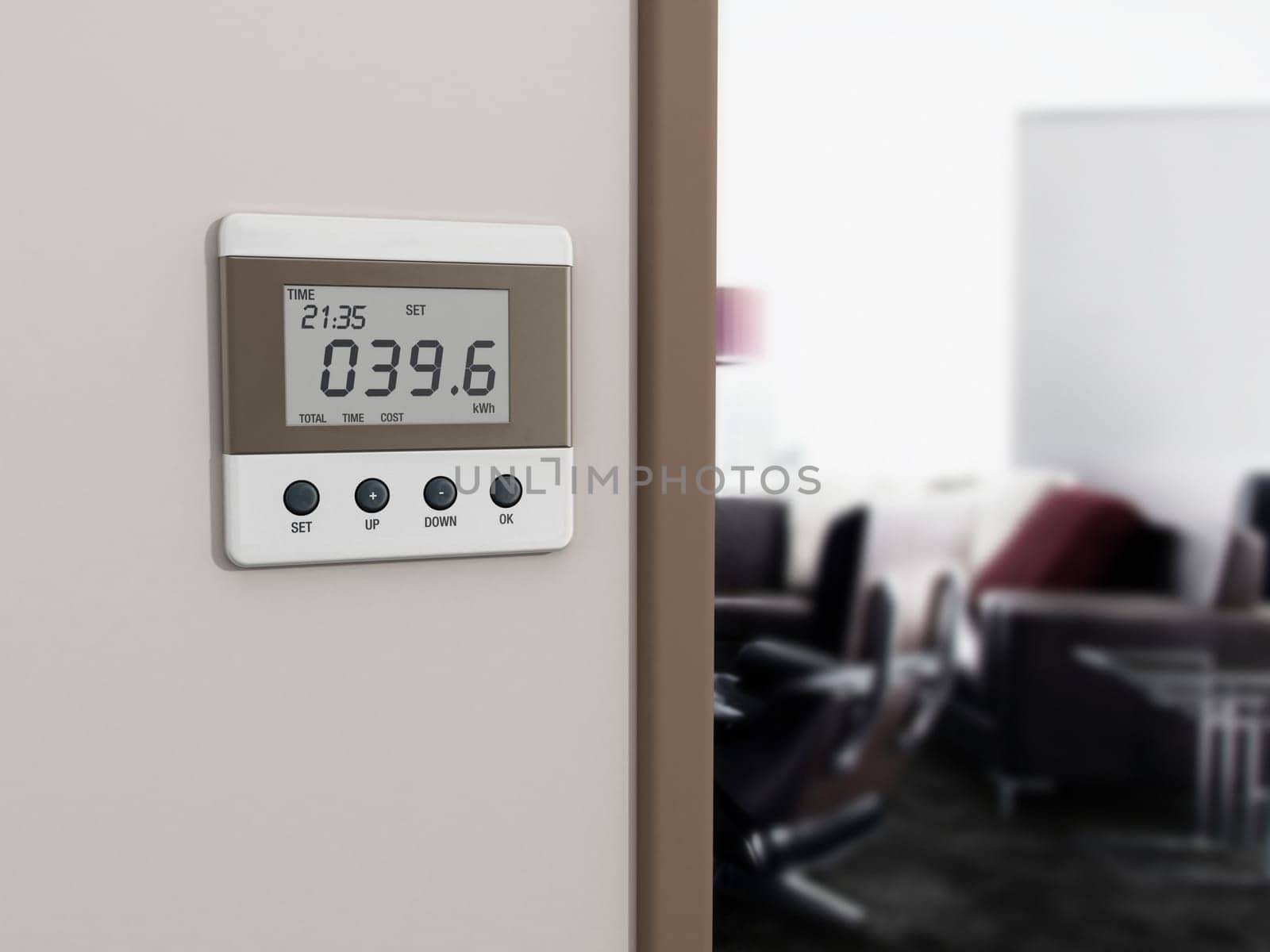 Wall mounted energy meter beside the room entrance.