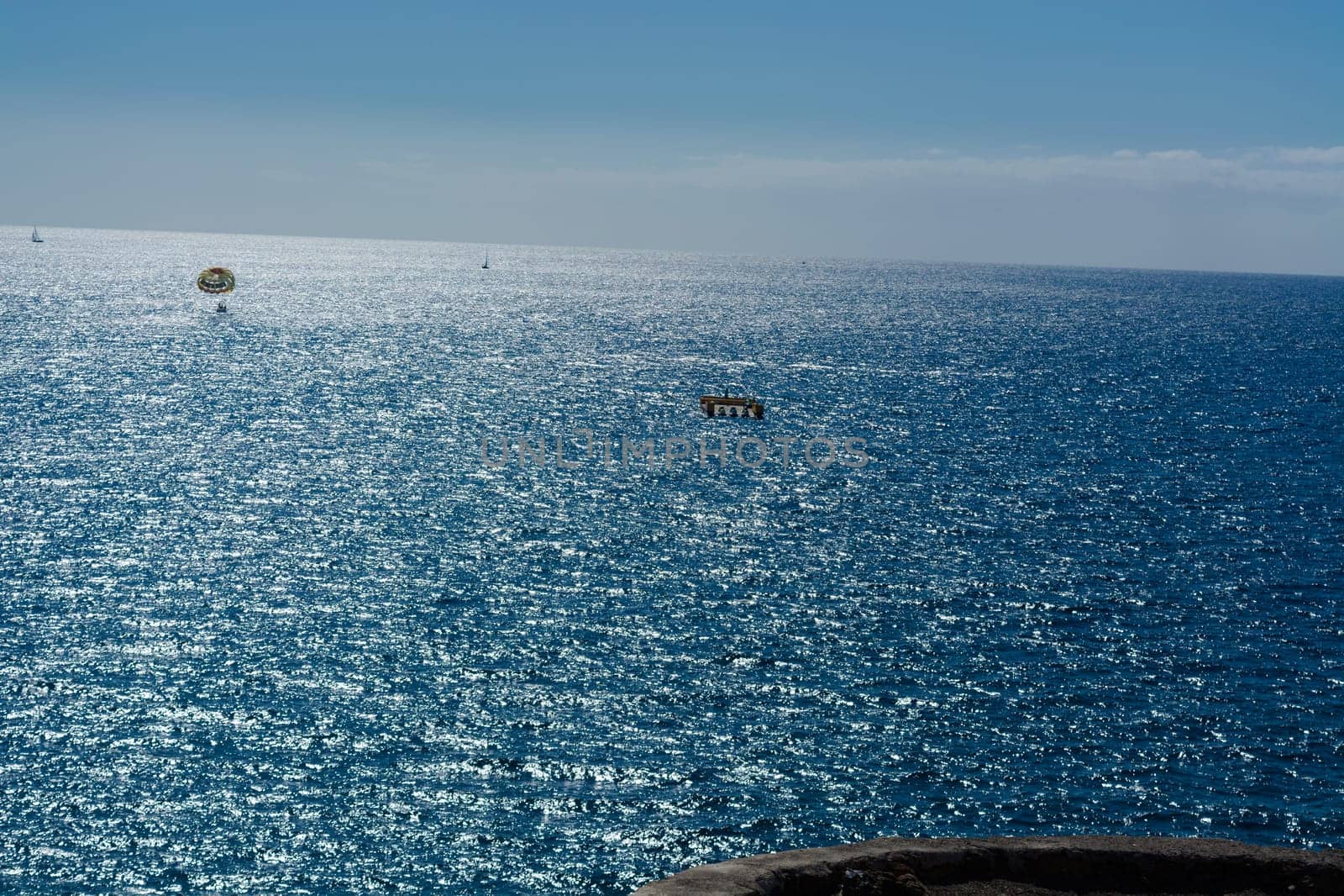 Parasailing, boat parachute. Summer water beach extreme sports..