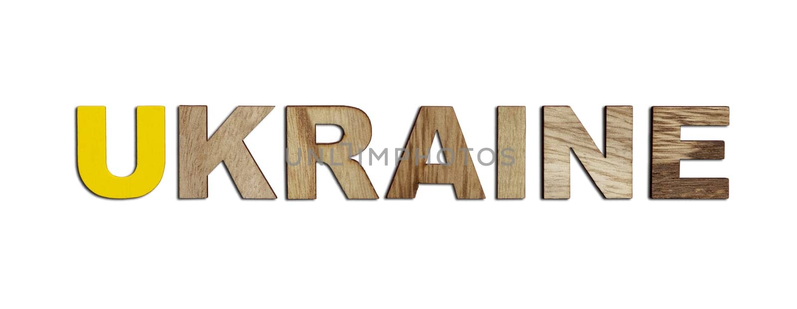 Ukraine, word written in colorful wooden alphabet letters isolated. The concept of a terrible war for independence. Top view. Copy space