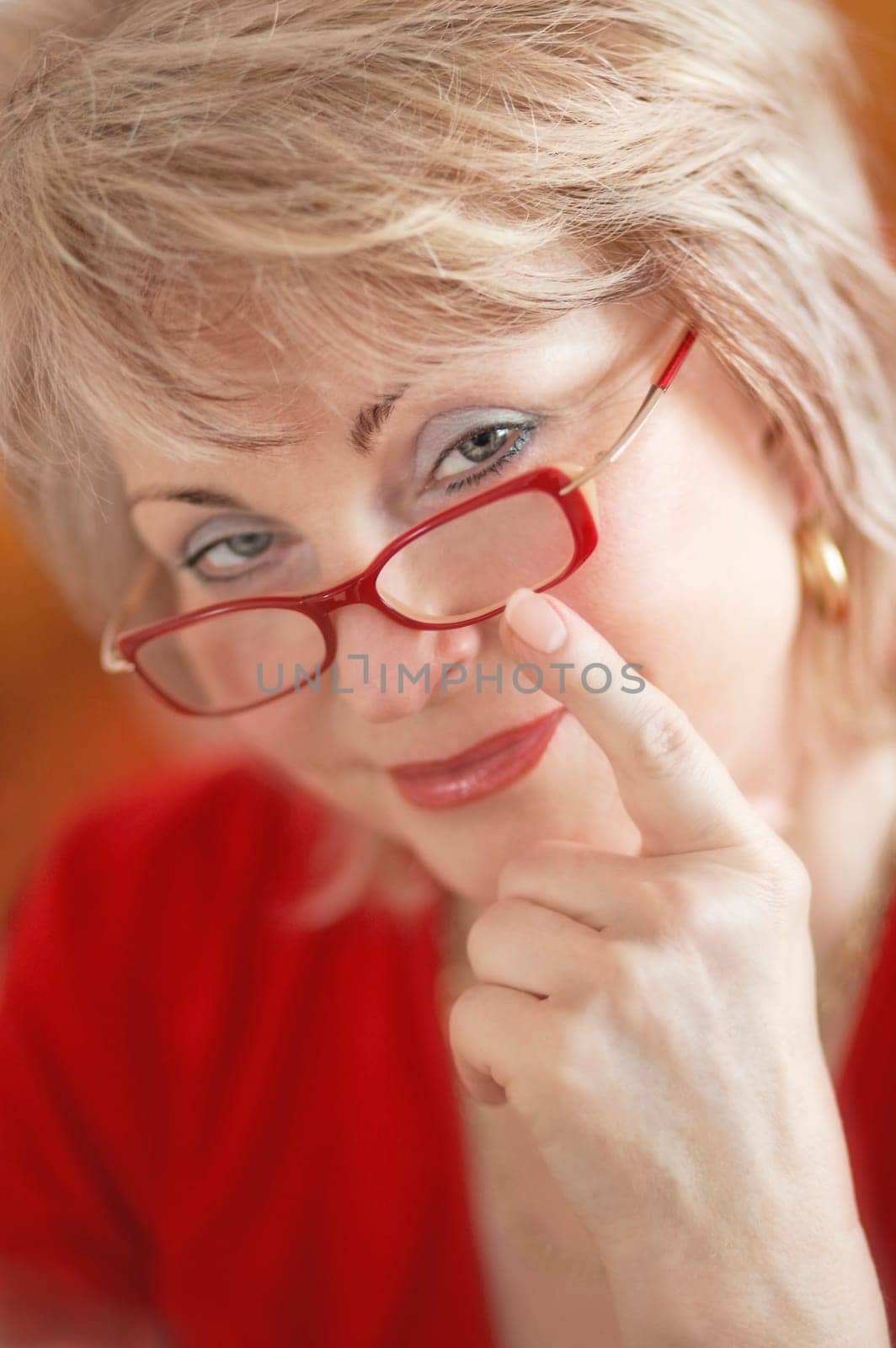 Behind red glasses