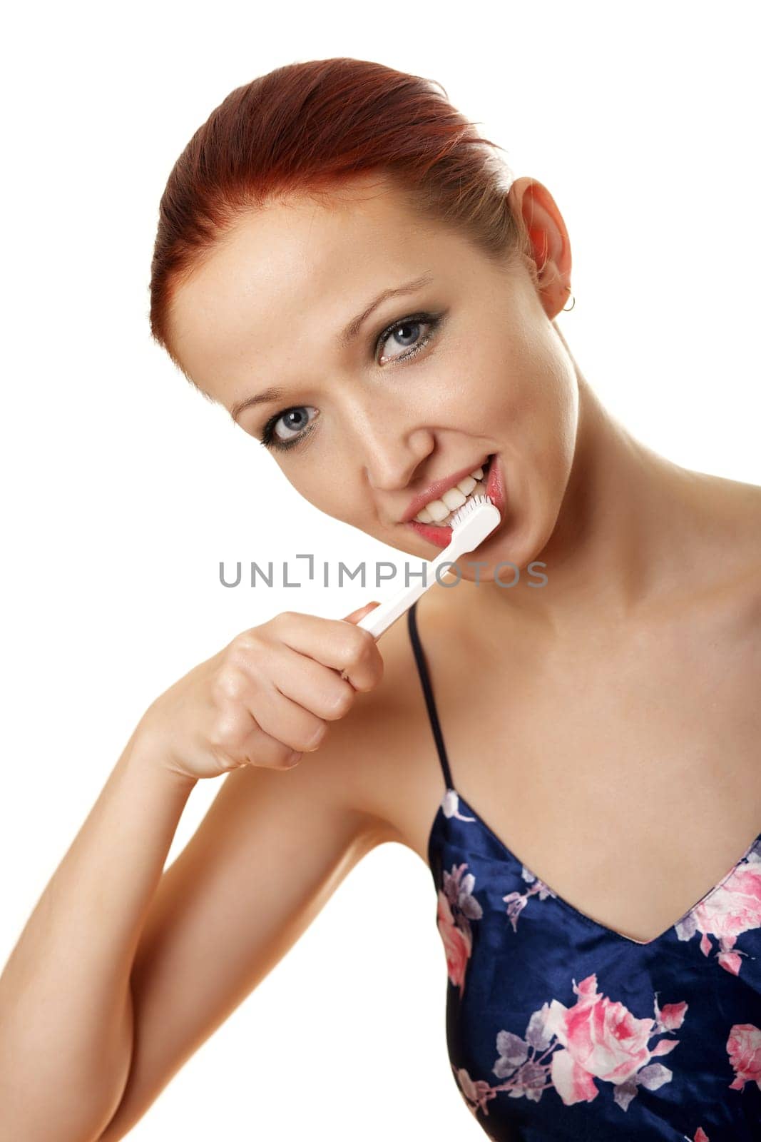 Young woman brushes her teeth II.