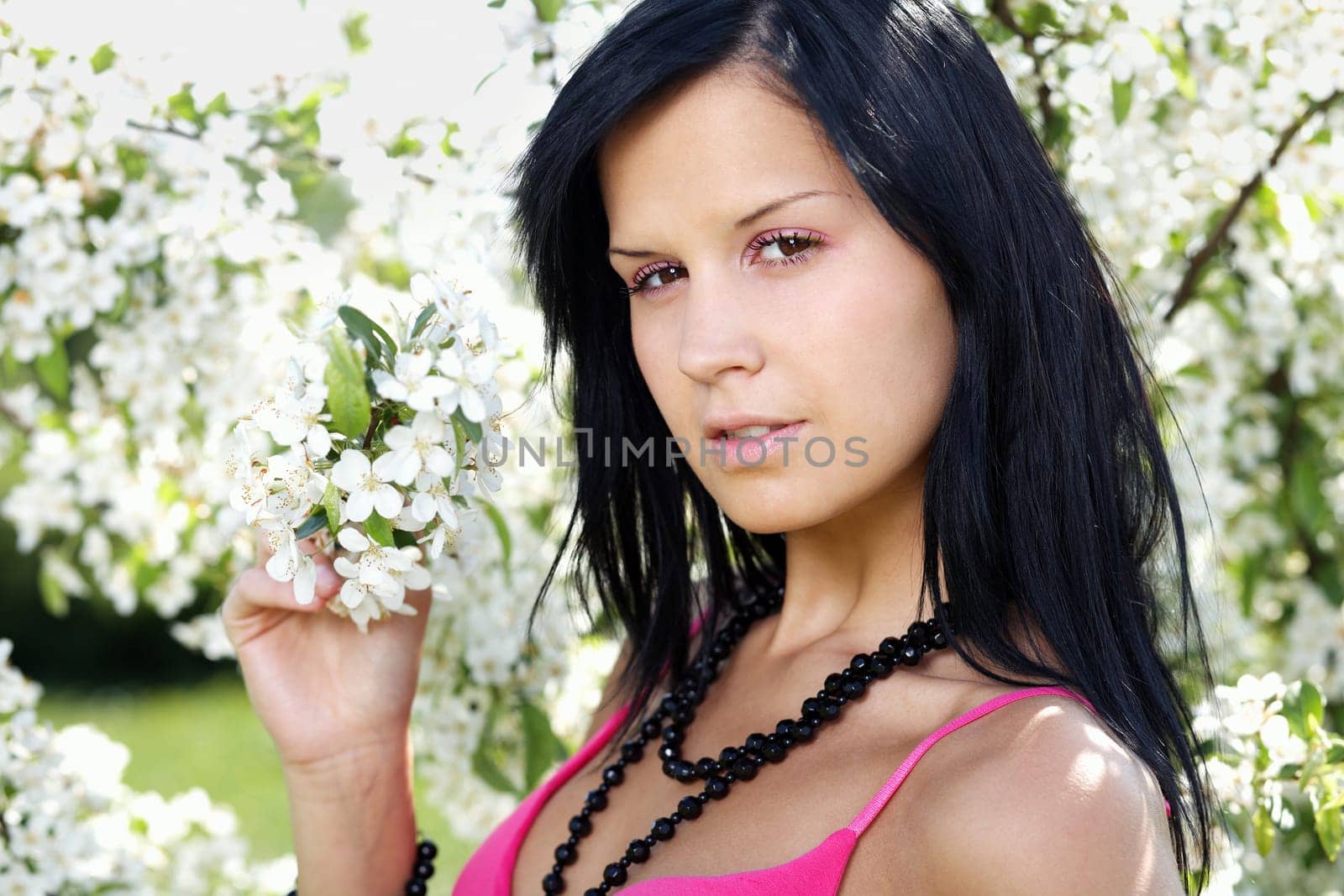 Black-haired woman poses at Apple Tree III.