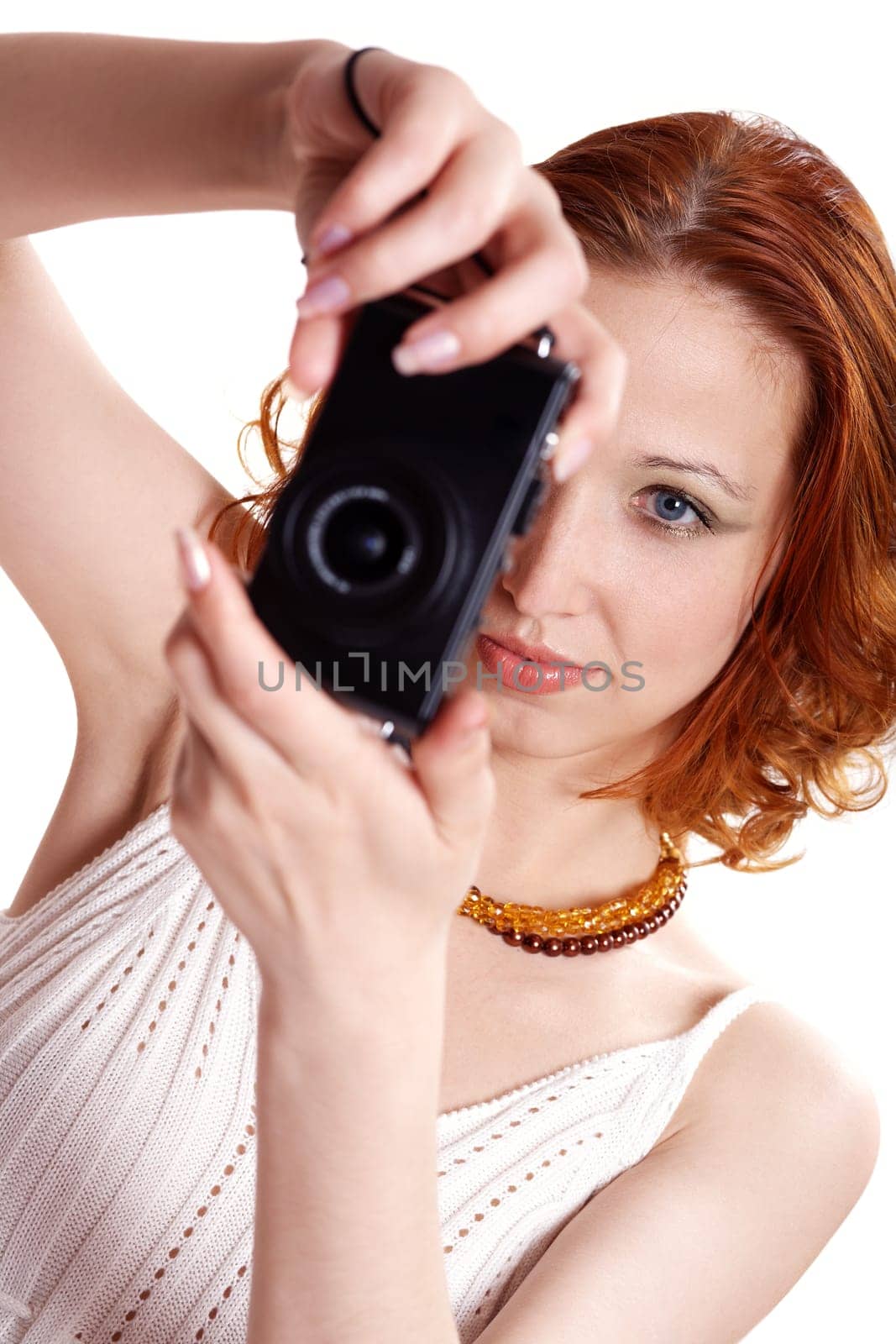 Red-haired woman photographing II.