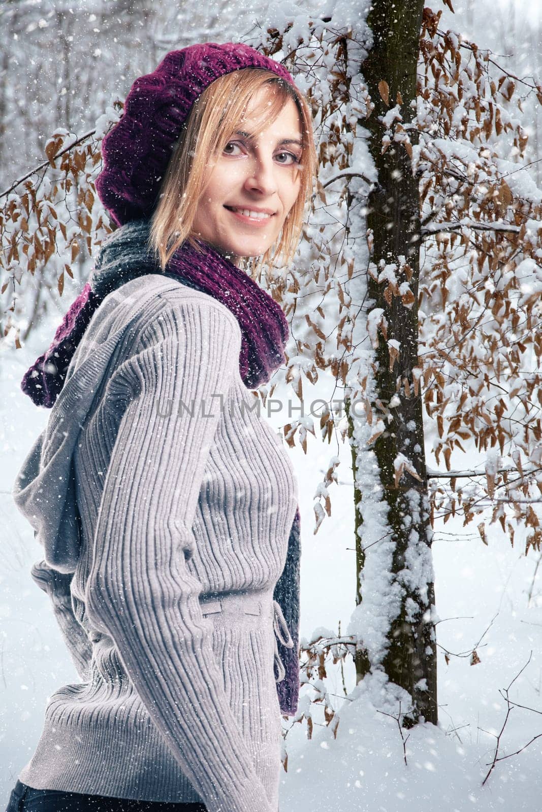 Blonde woman in snowy landscape