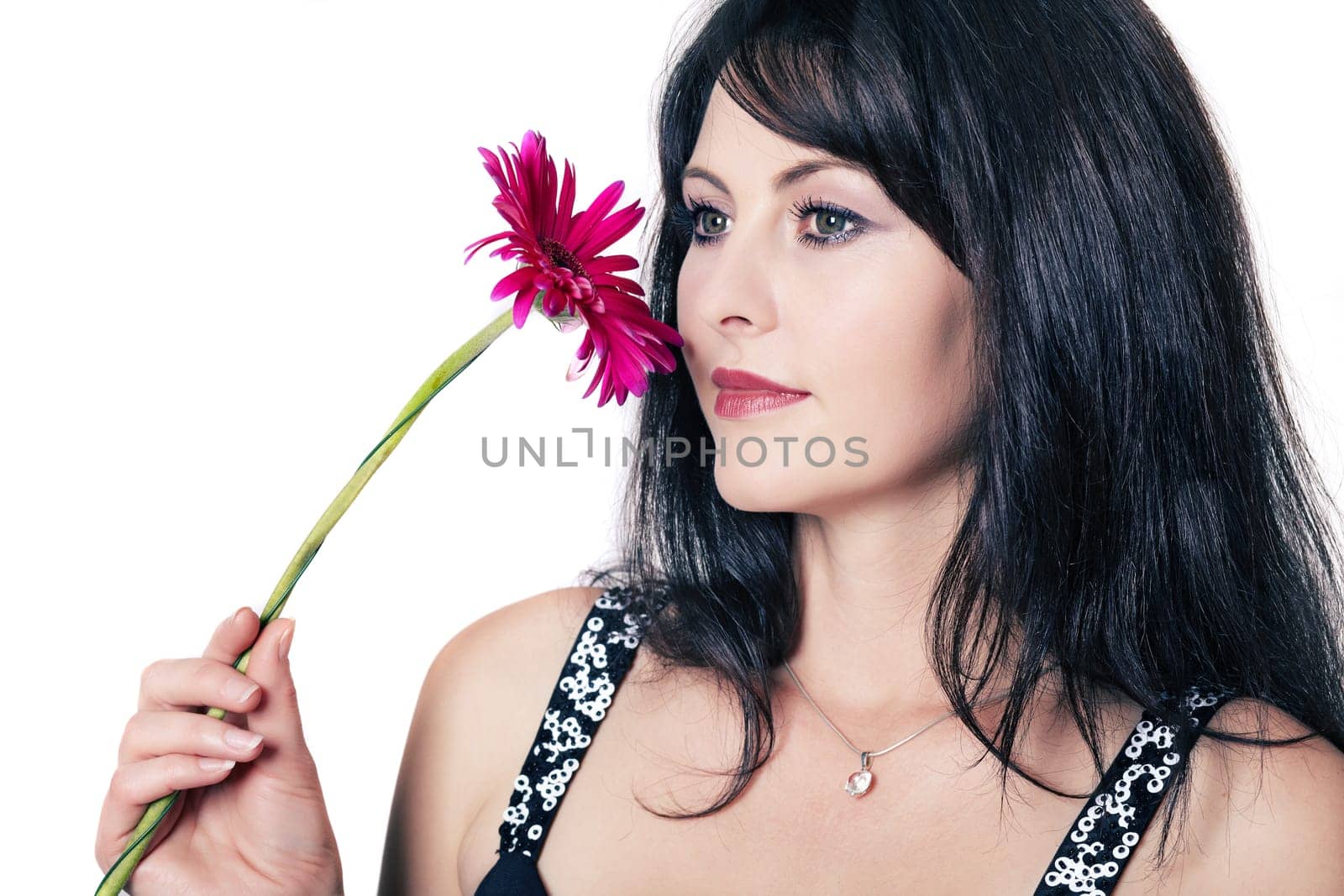 Black-haired woman with gerbera