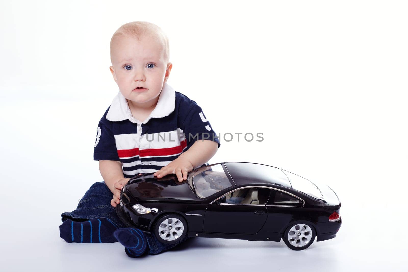 Small child by car I.