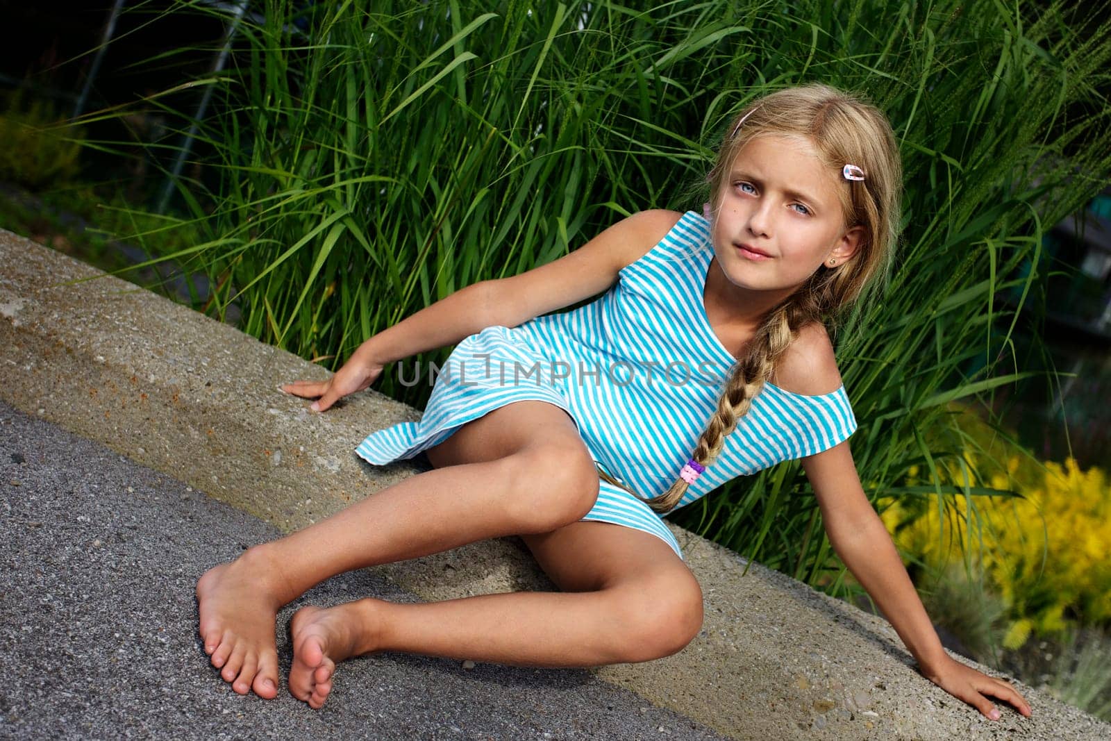 Beautiful girl relaxing on the rock IV