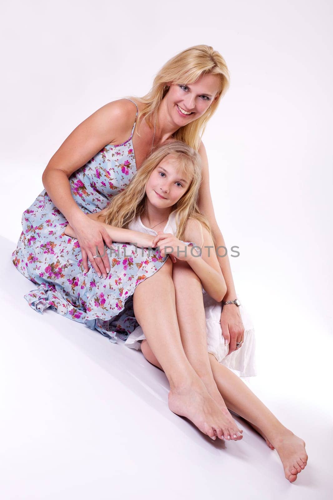 Mother and daughter dressed in summer wear