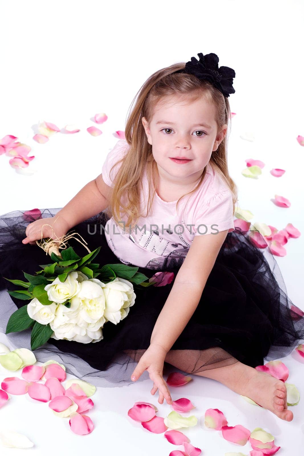 Little girl with bunch of flowers I