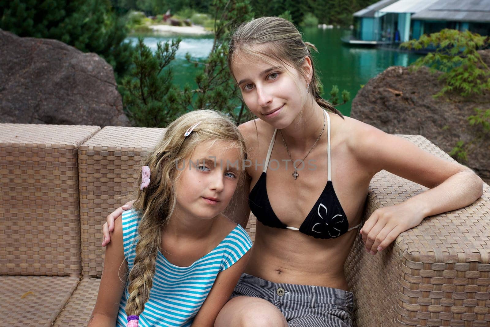 Two friends relaxing on the armchair