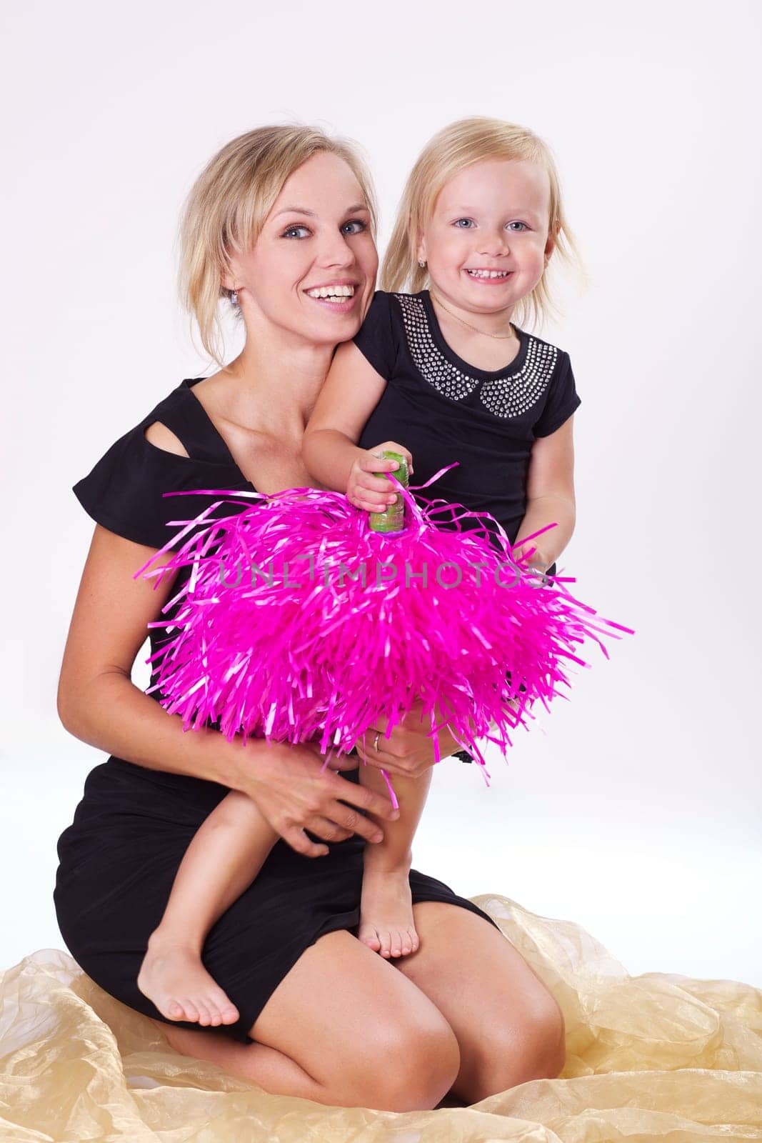 Young mother playing with daughter