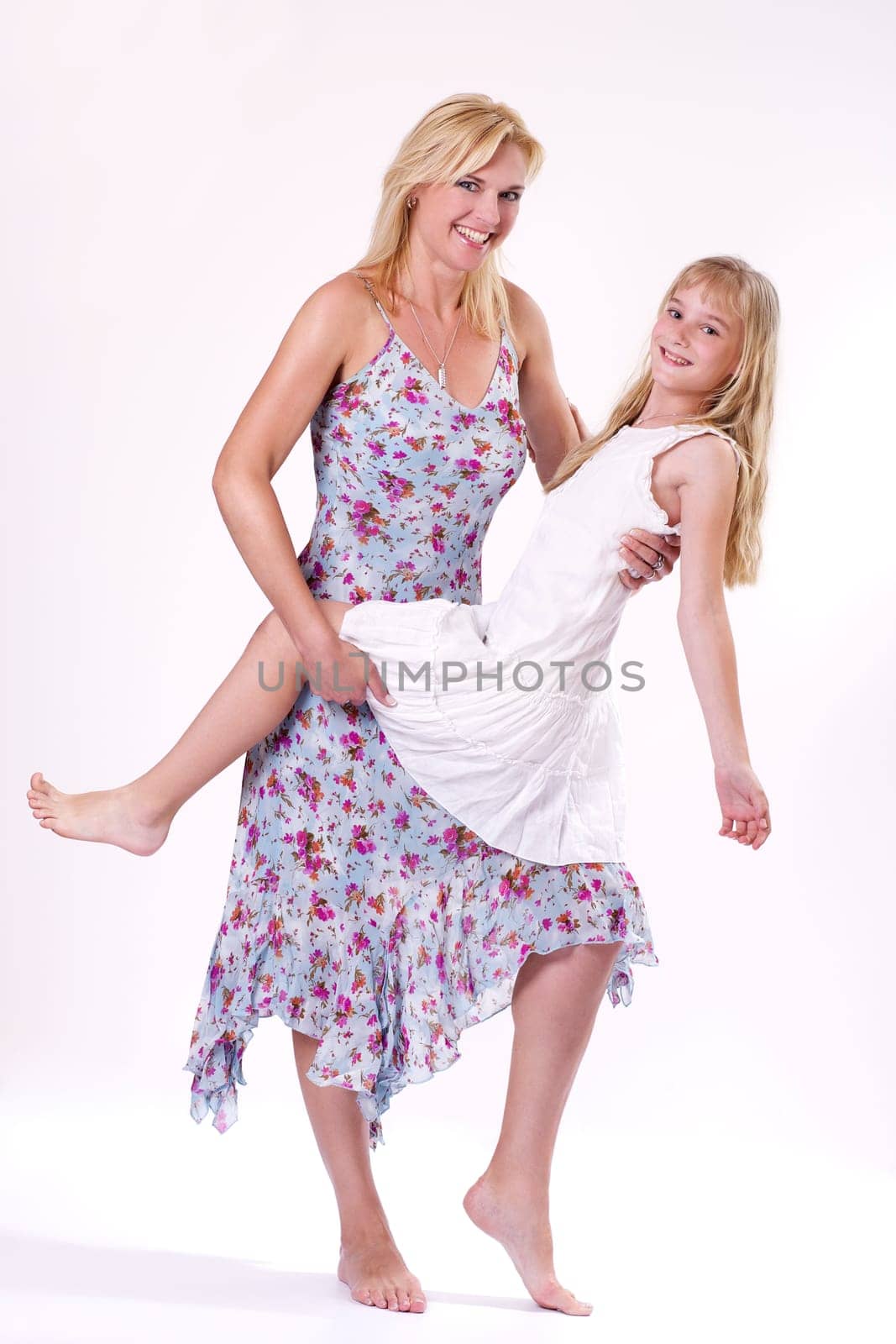 Mother and daughter dressed in summer wear