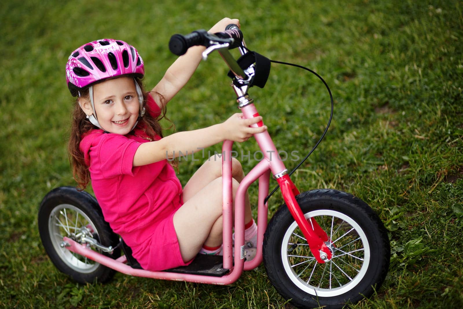 Portrait of a girl with a scooter
