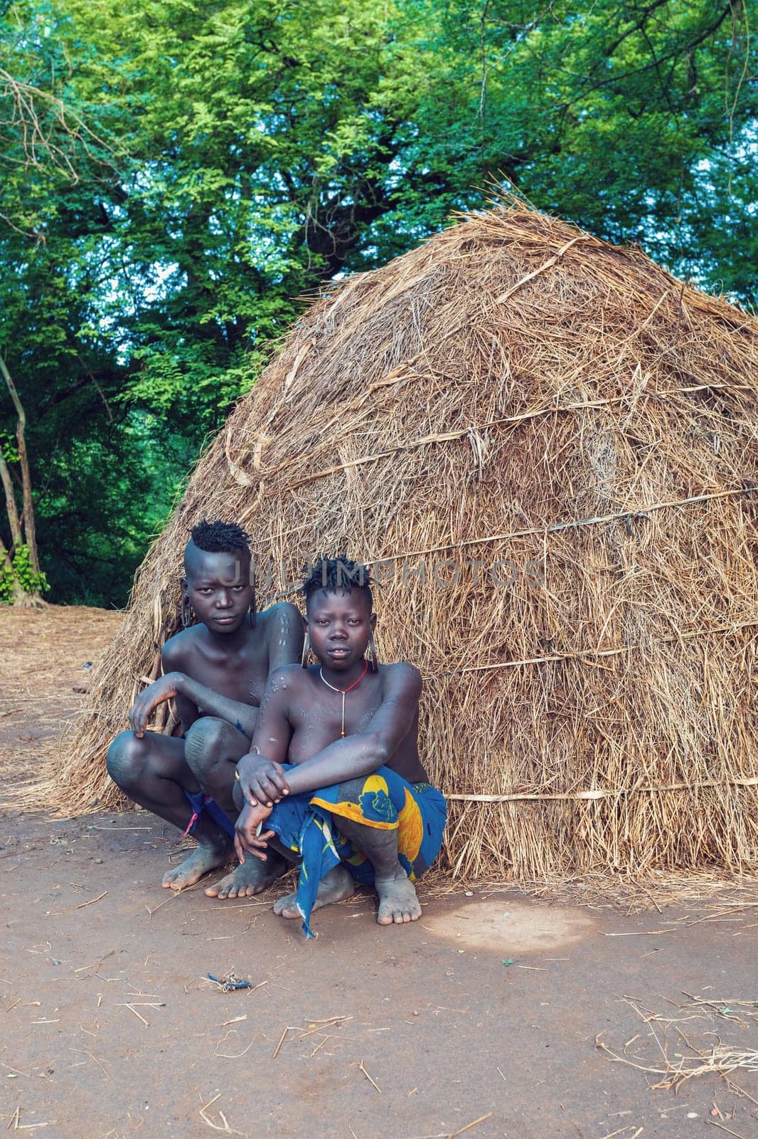 Omo valley, Ethiopia - May 6, 2019: Young teenage women of wildest and most dangerous African Mursi people tribe living according to original traditions in Omo valley, May 6, 2018, Ethiopia, Africa