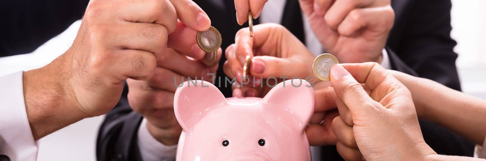 Crowdfunding Concept. People Inserting coins into piggybank