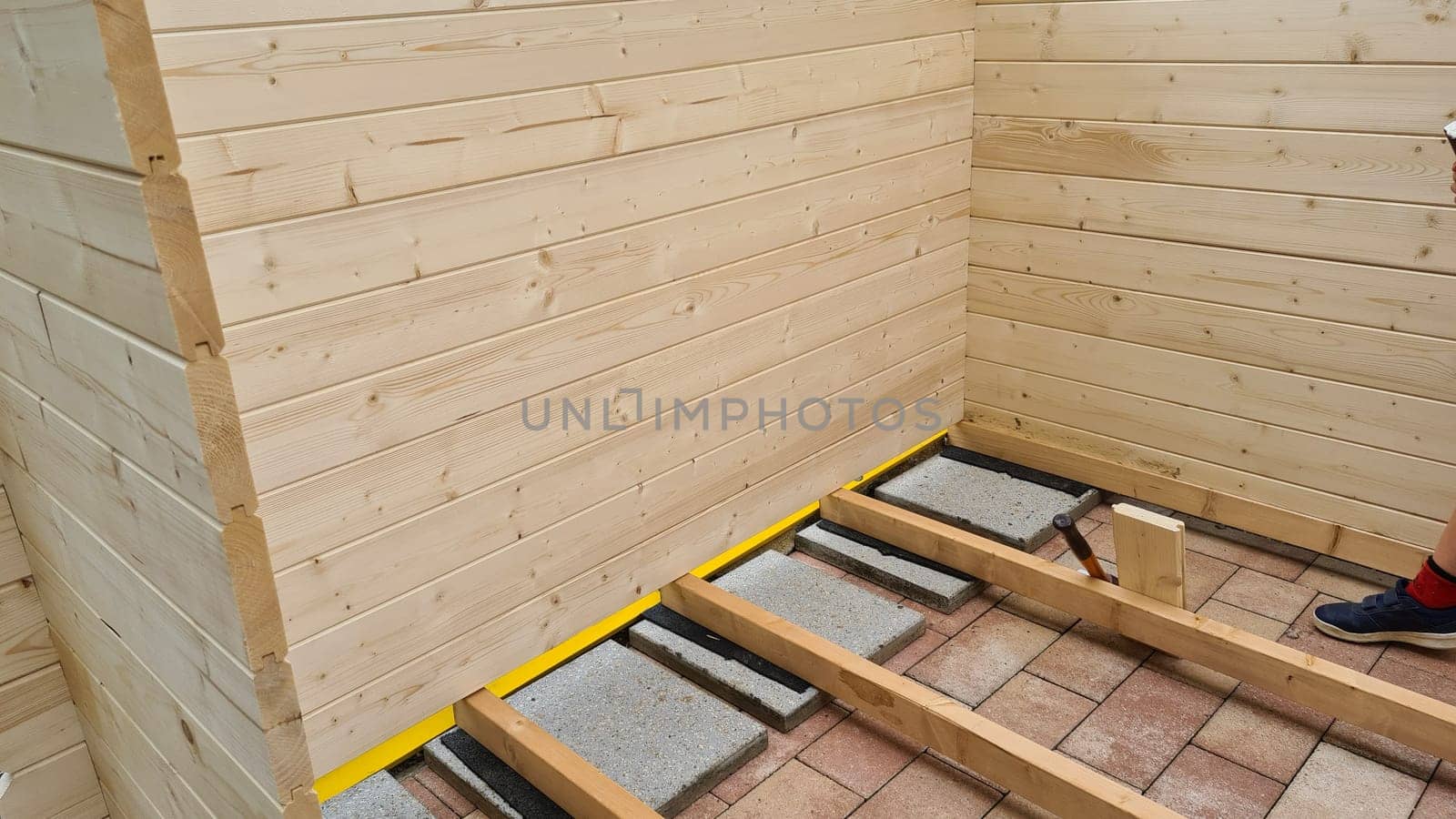 Garden shed built from tree trunks
