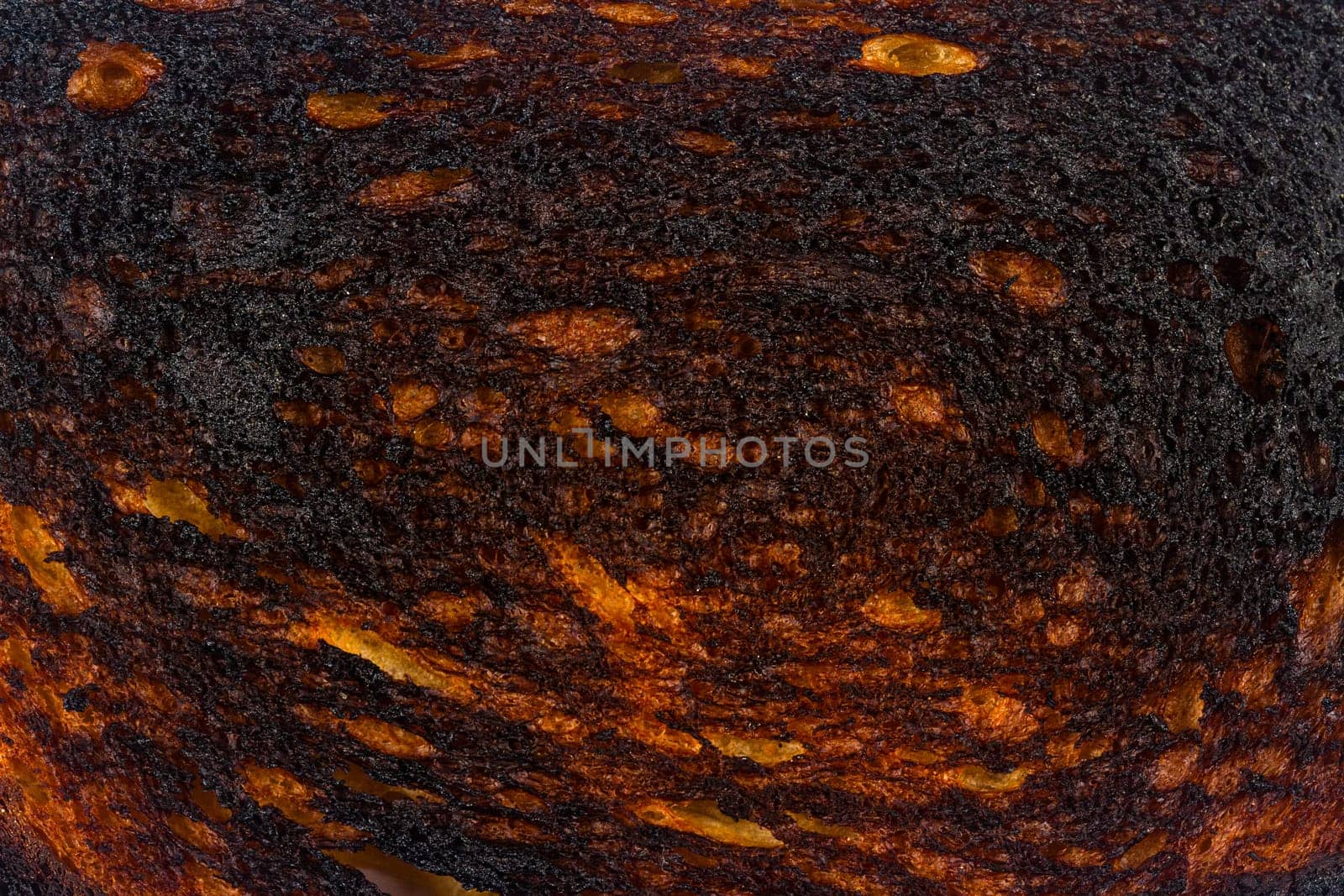 top view macro closeup of black burnt toast bread slice texture background