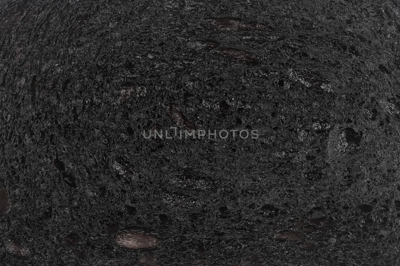 top view macro closeup of black burnt toast bread slice texture background