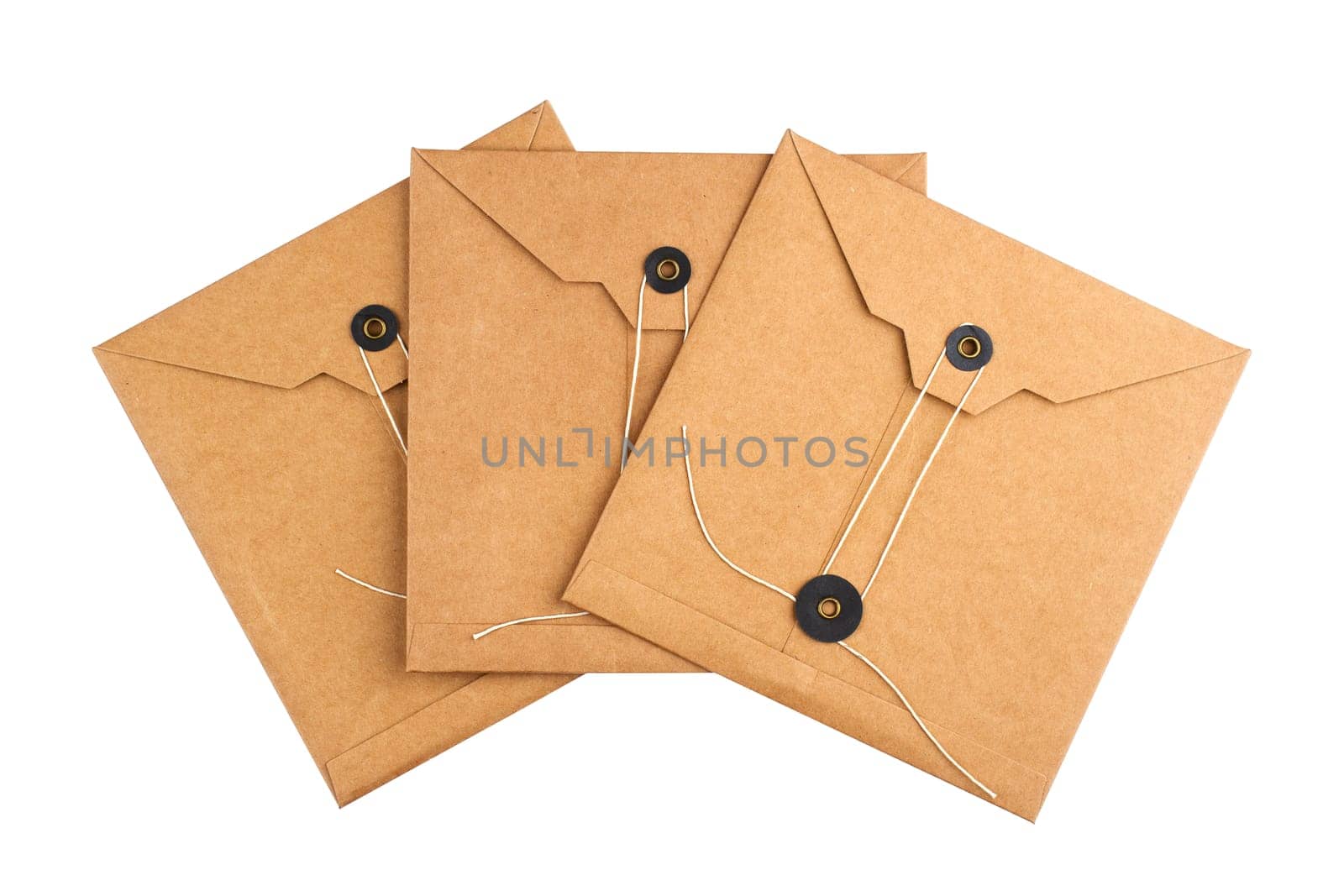 top view closeup three of closed square vintage craft paper envelopes with textile thread enclosing isolated on white background