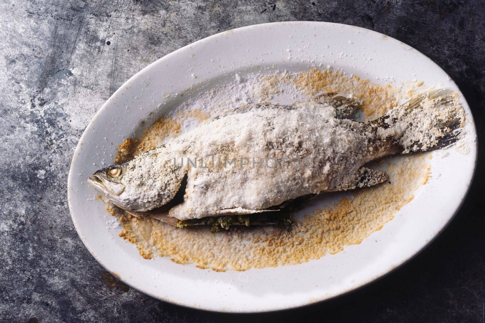 close up of sicilian italian salt baked seabass fsh