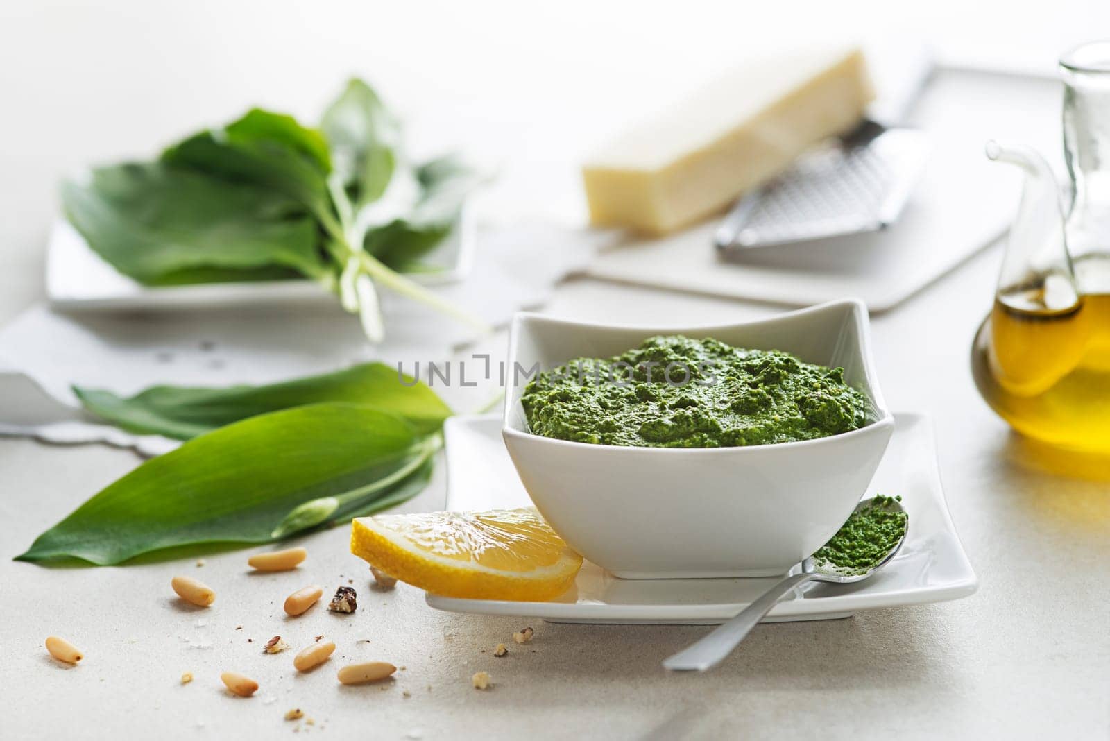 Making Fresh ramson or wild garlic pesto close up. Healthy spring food concept