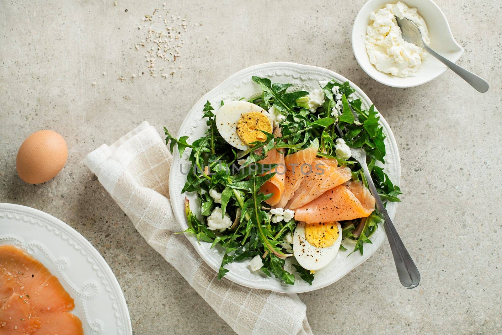 Dandelion salad with smoked salmon, egg and fresh cheese