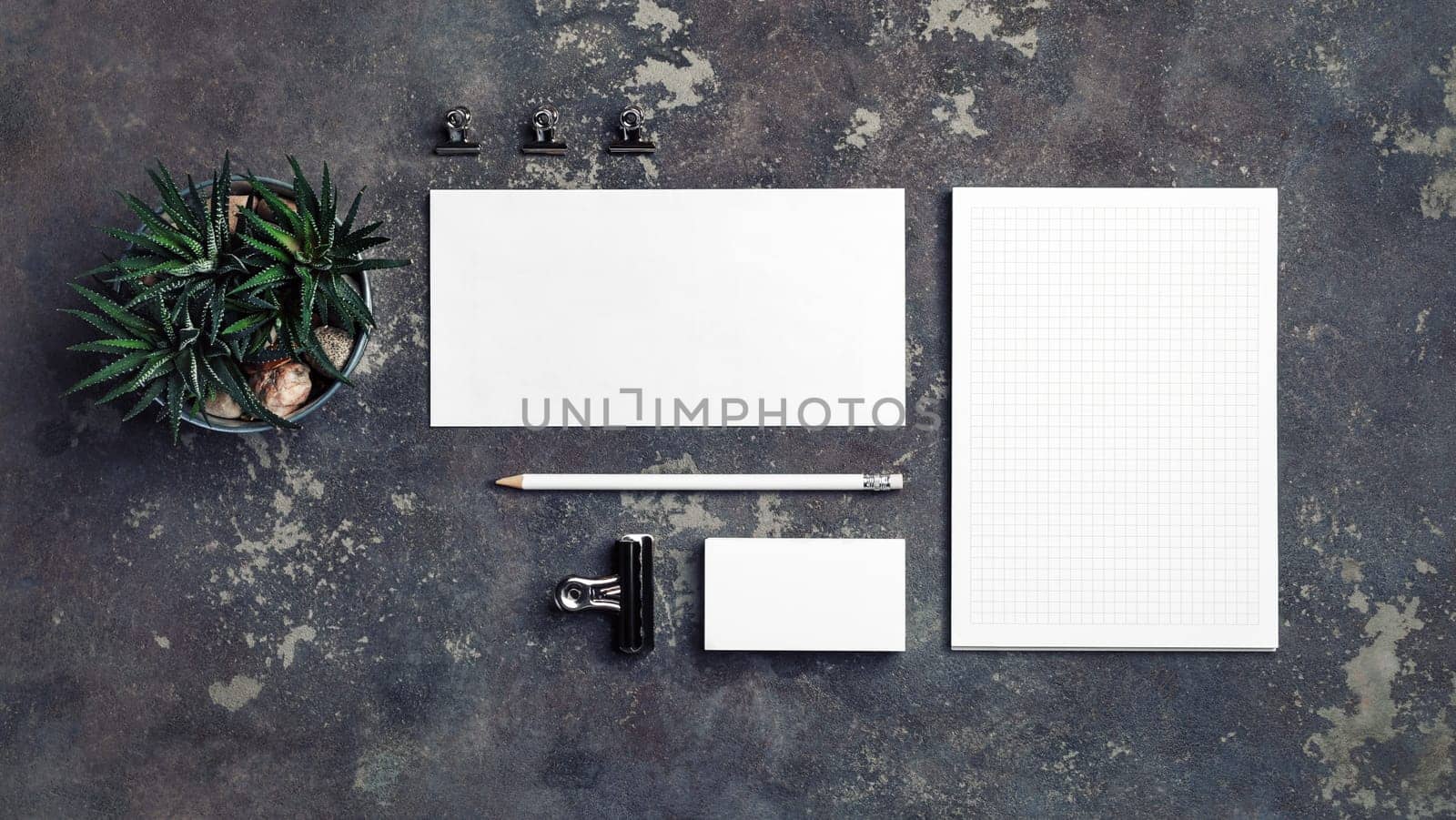 Blank corporate stationery set on concrete background. Template for branding design. Branding mock up. Top view.