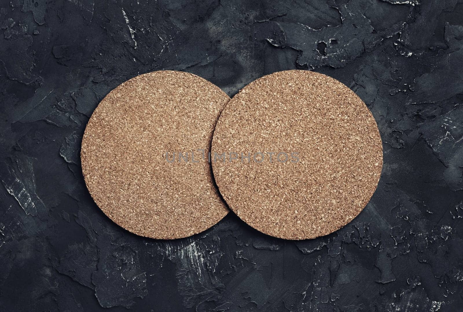 Photo of two blank cork beer coasters. Blank template for your design. Top view.