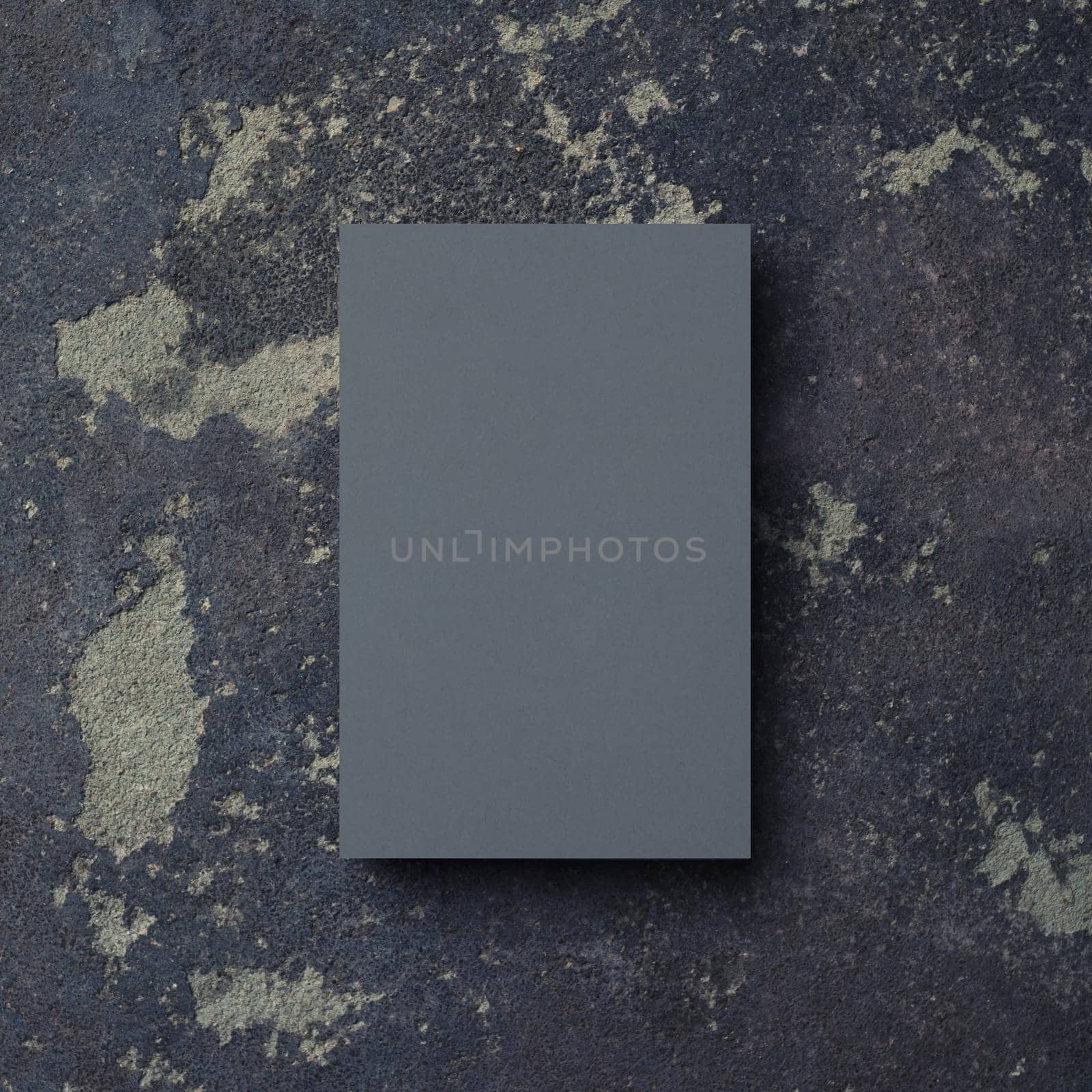 Photo of blank grey business card on concrete background. Branding mock up. Top view.