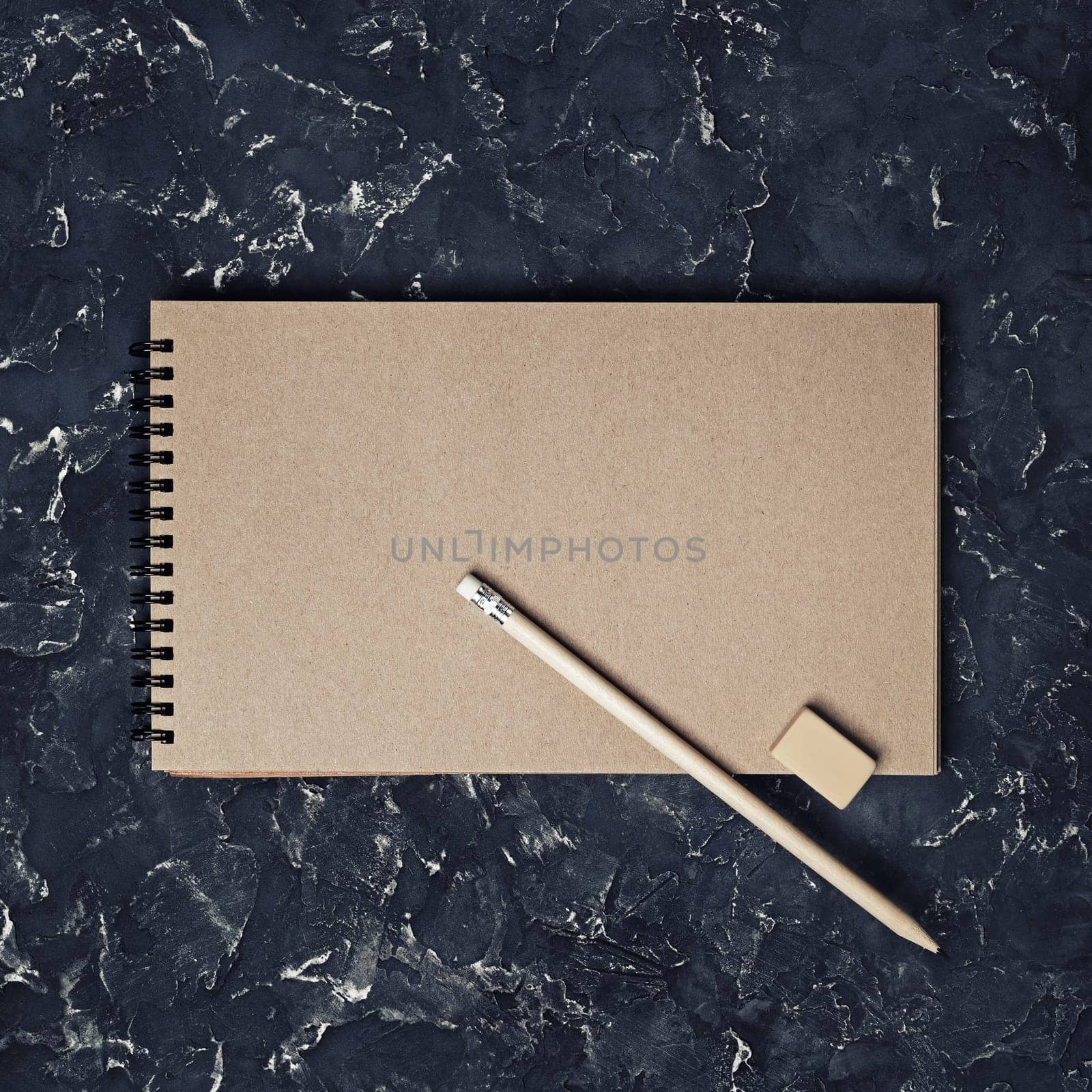 Blank vintage sketchbook, pencil and eraser. Blank branding template. Mock-up for design presentations and portfolios. Top view.