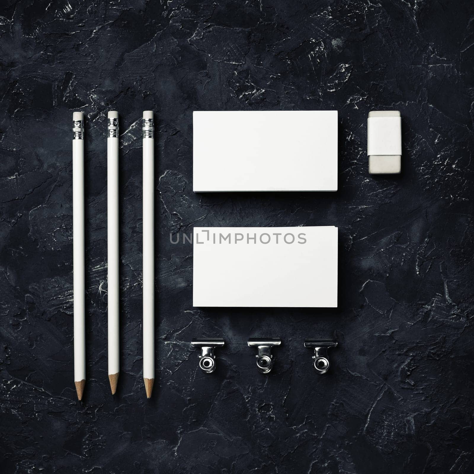 Photo of blank corporate identity. Stationery set. Branding mockup. business cards, pencils, eraser and clips. Top view. Flat lay.