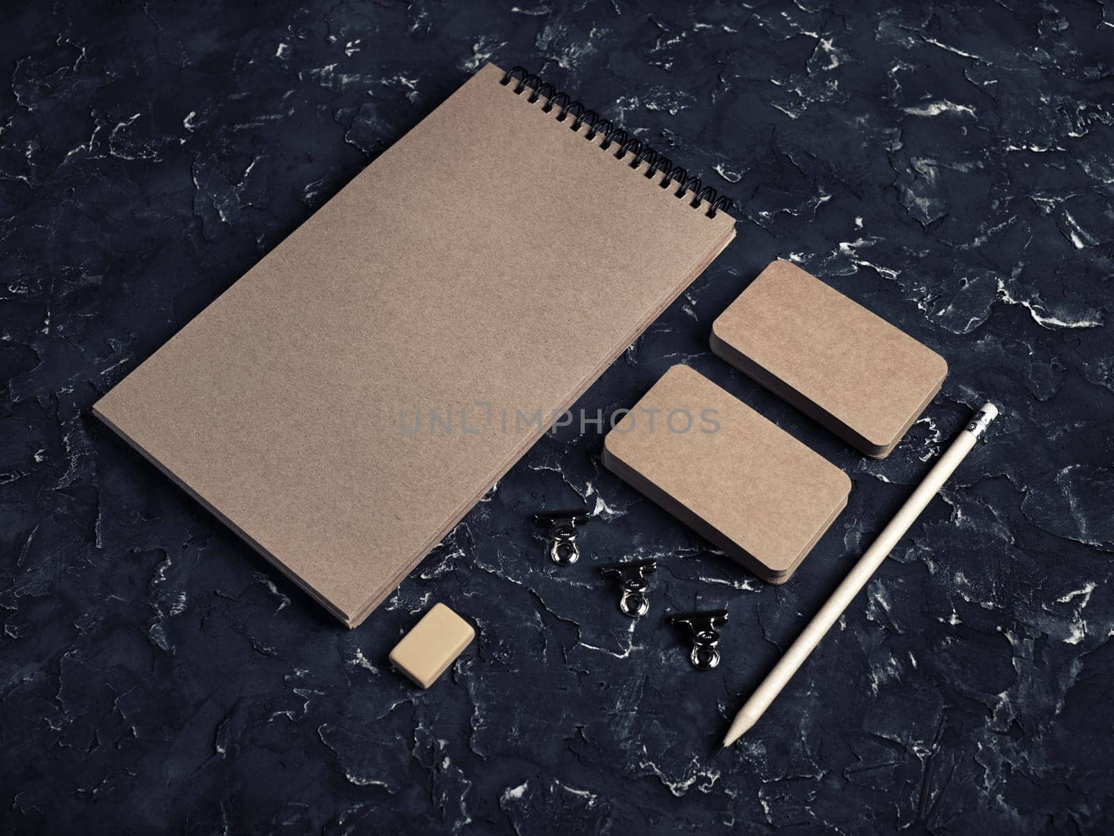 Kraft stationery mock up. Blank corporate identity template on black plaster background. Responsive design mockup.