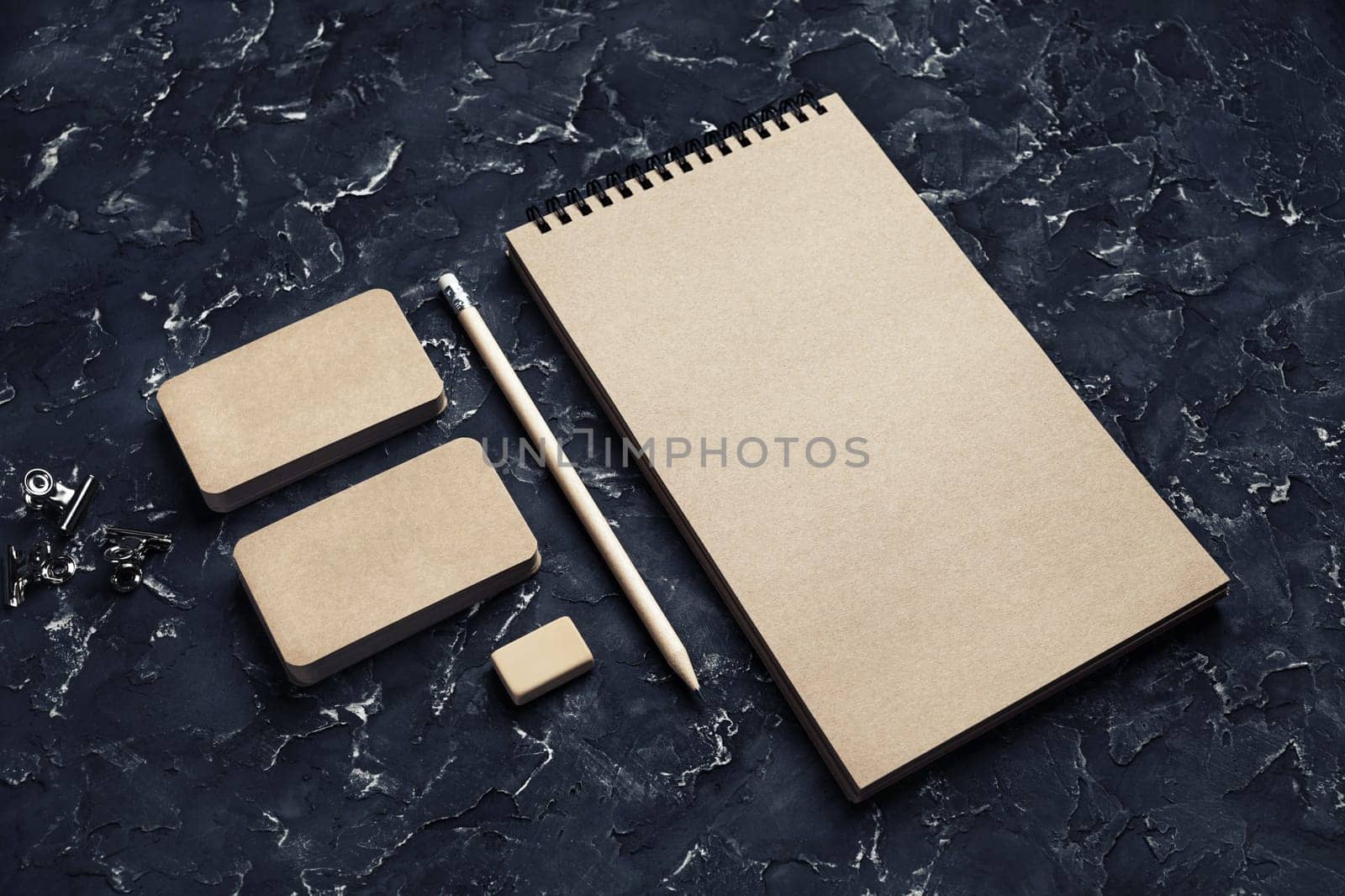 Blank kraft stationery set. Corporate identity template on black plaster background. Responsive design mockup.