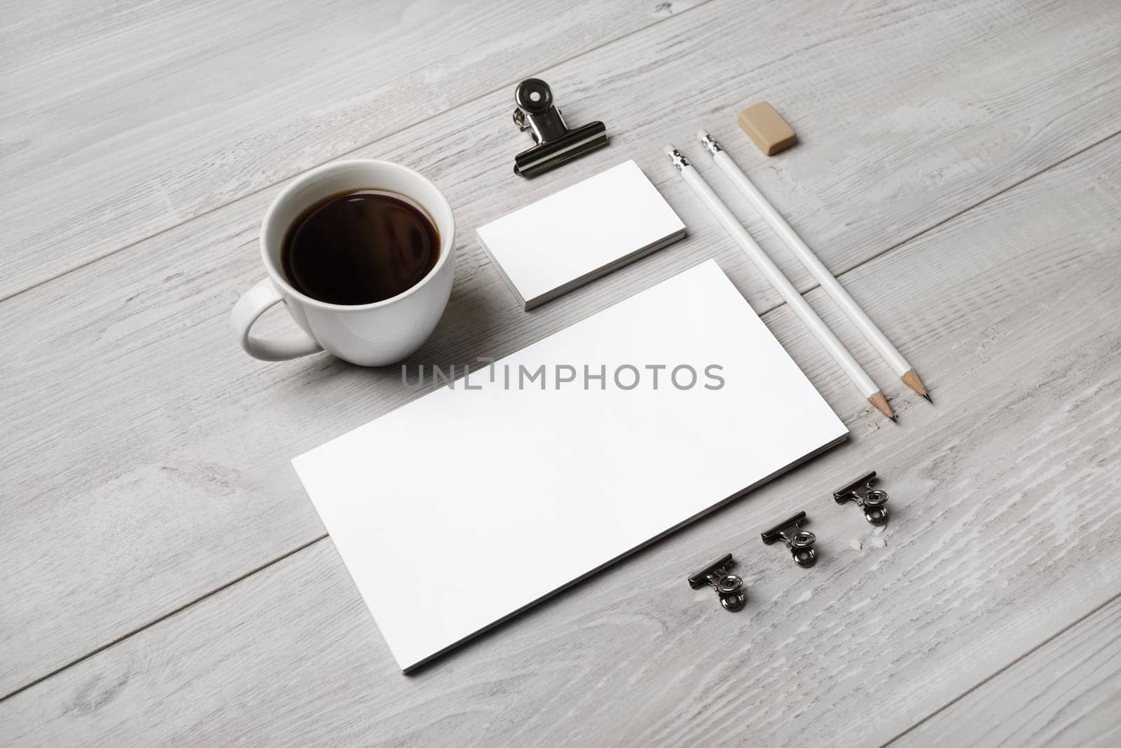 Blank corporate stationery mockup on light wooden background. Branding mock up for designers portfolios.