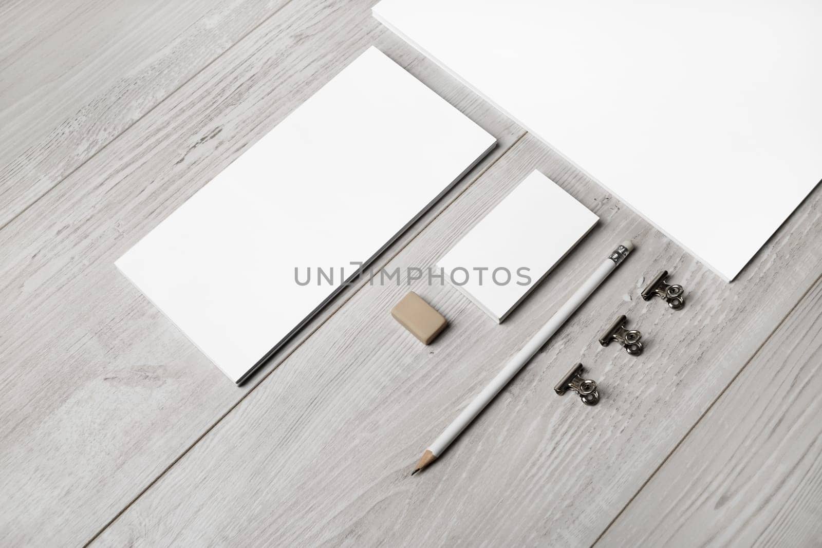 Blank stationery template on light wooden background. Mock-up for branding identity. For design presentations and portfolios.