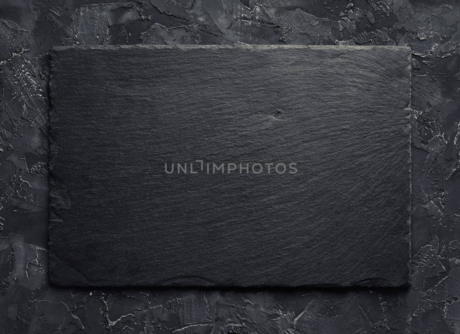 Blank black slate plate background. Top view.