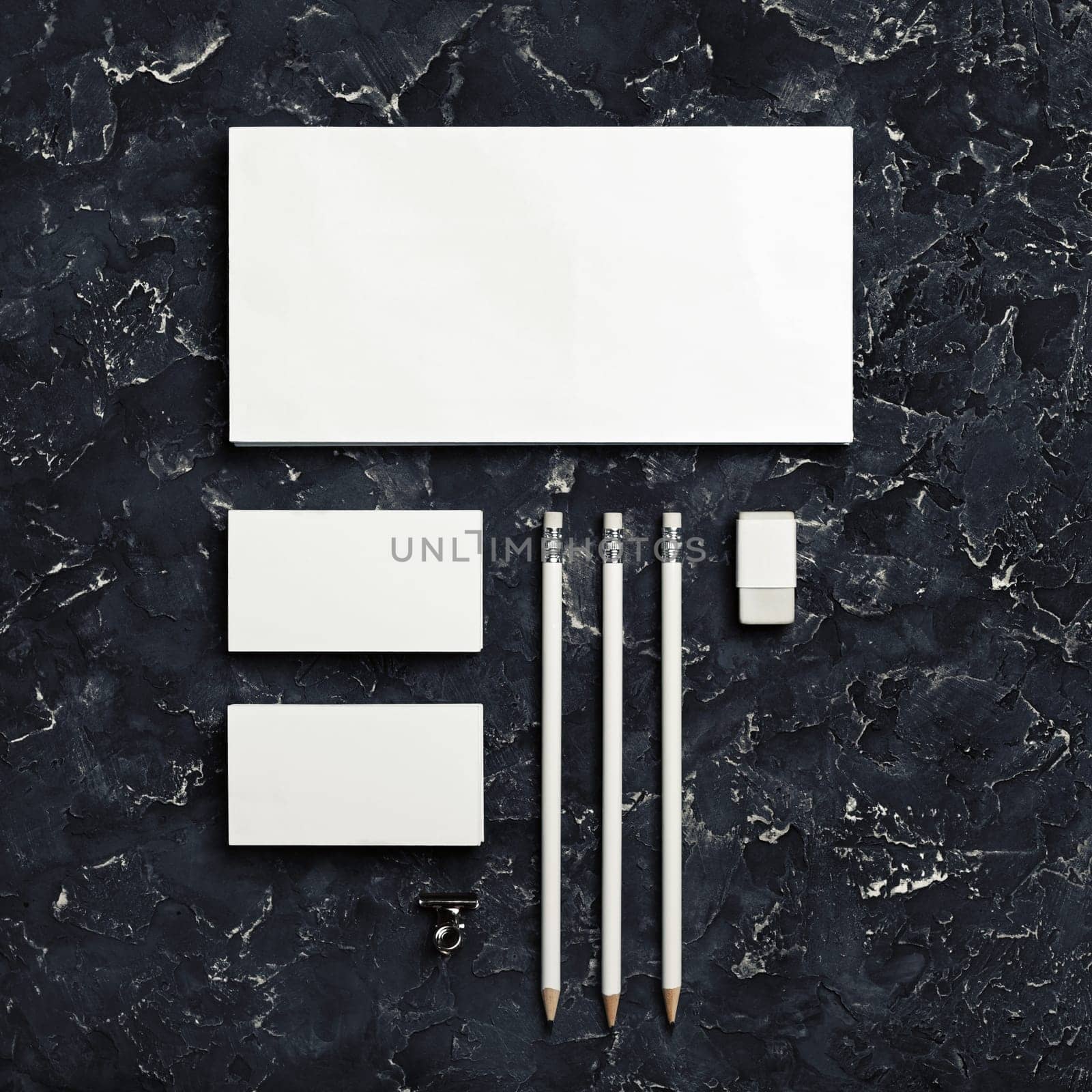 Branding stationery mockup on black plaster background. Blank objects for placing your design. Top view.