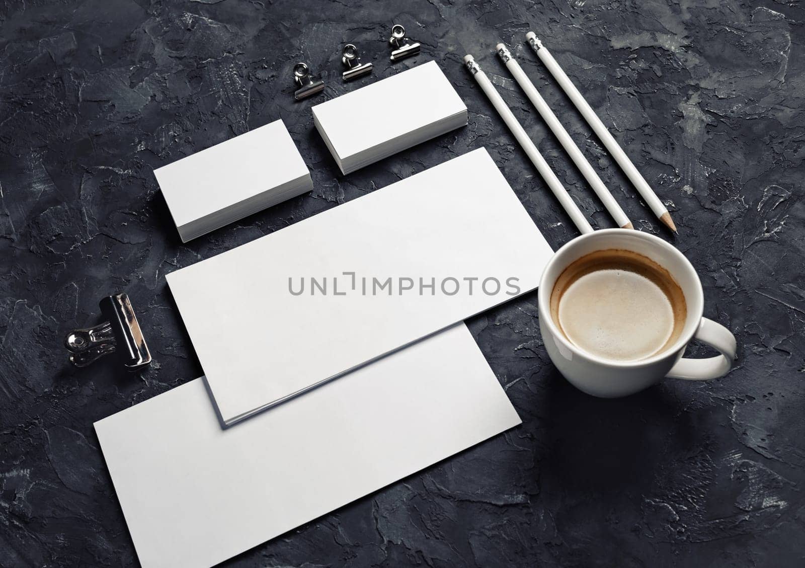 Blank stationery and corporate identity template on black plaster background. Responsive design mockup.