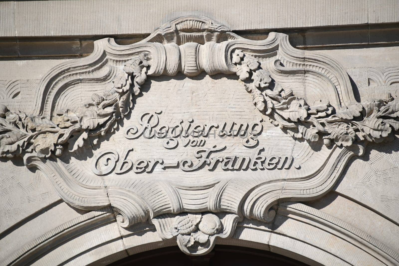 Sandstone sign from the government of Upper Franconia on a historic building in Bayreuth. The city of Bayreuth is located in Bavaria,Germany.