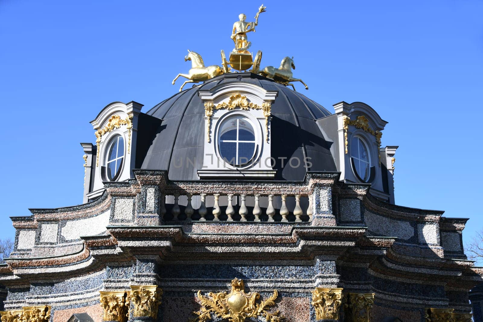 The Temple of the Sun in the Hermitage Bayreuth shows the gilded Apollo with torch,quadriga and horses. The temple was built in the park in 1753.