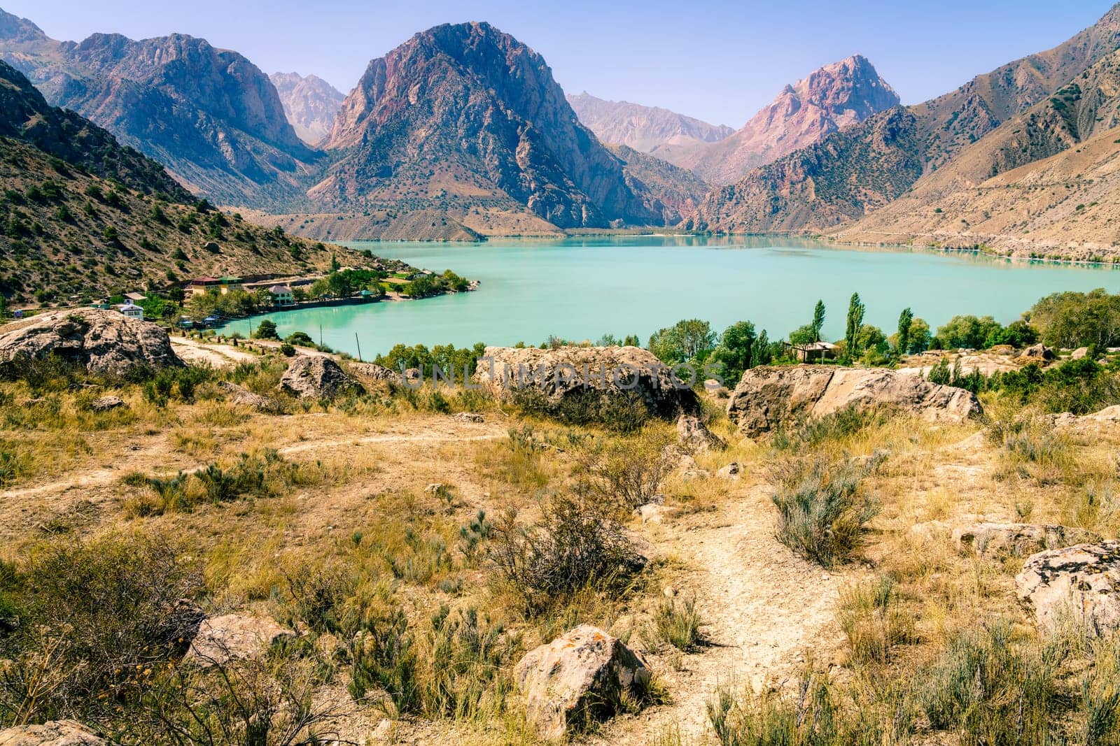 Scenic view of Iskanderkul - an alpine lake in the mountains of Tajikistan